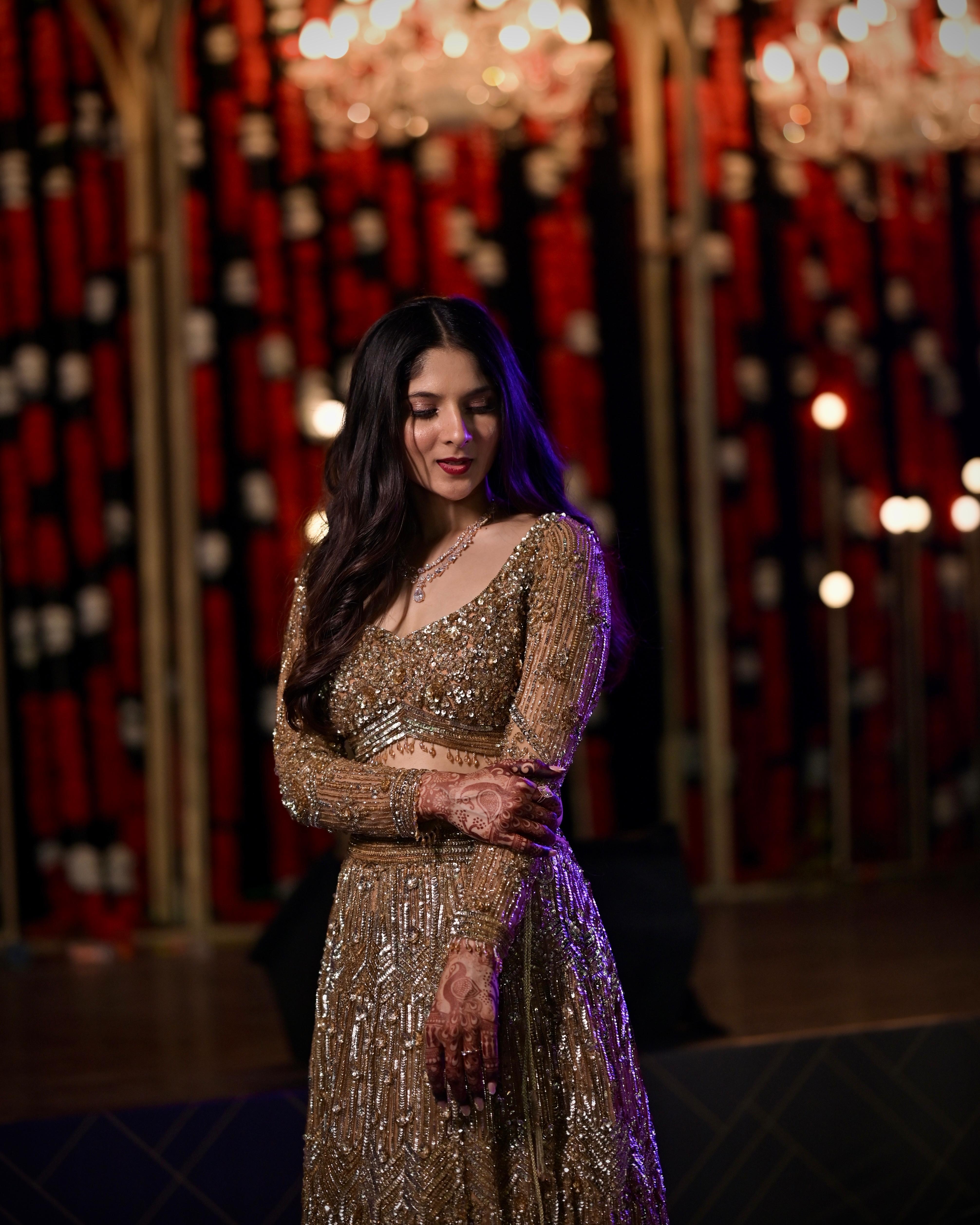 Priyanka Lalge in a gold embellished reception lehenga