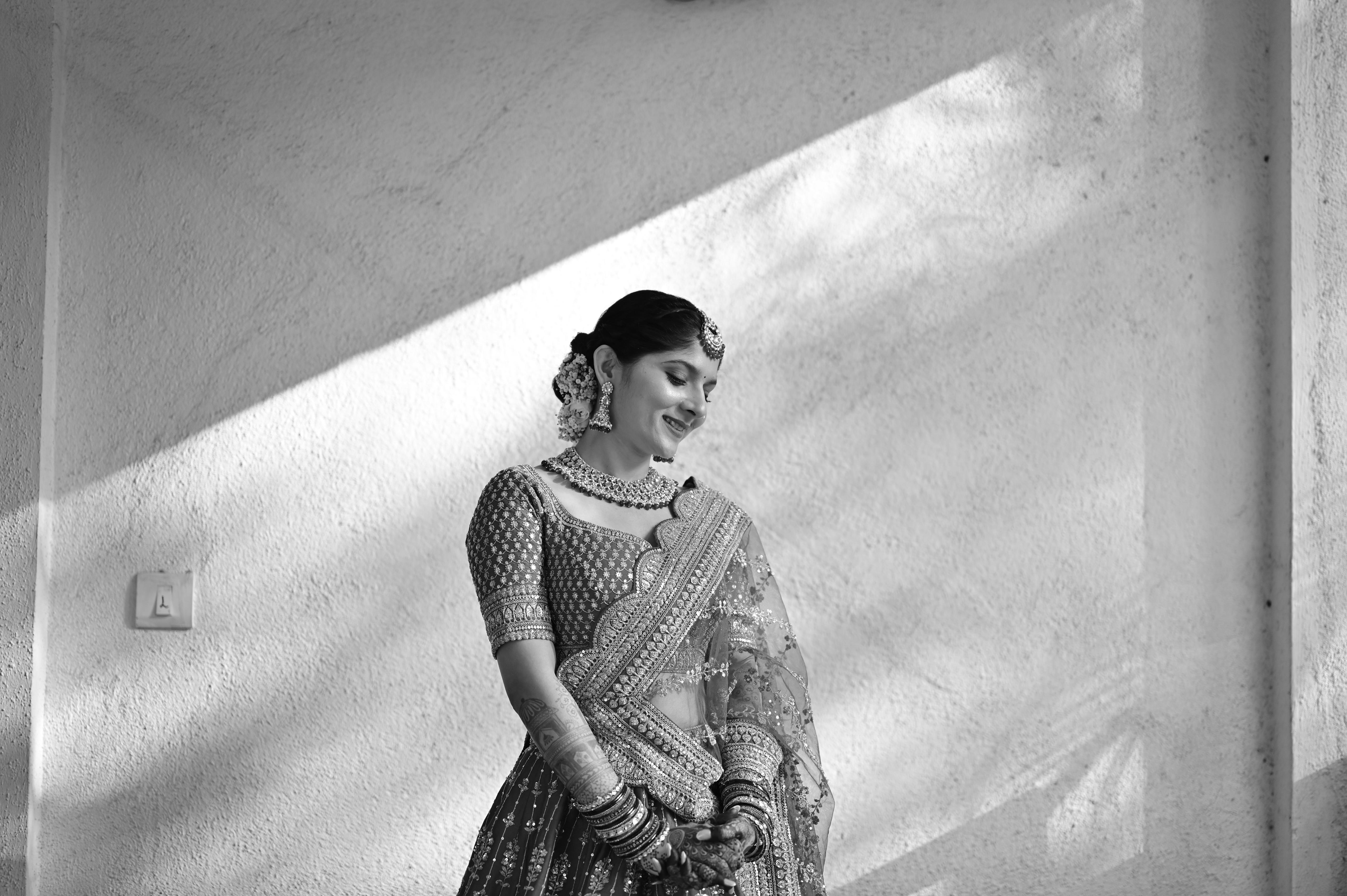Priyanka Lalge in traditional bridal attire — black and white portrait