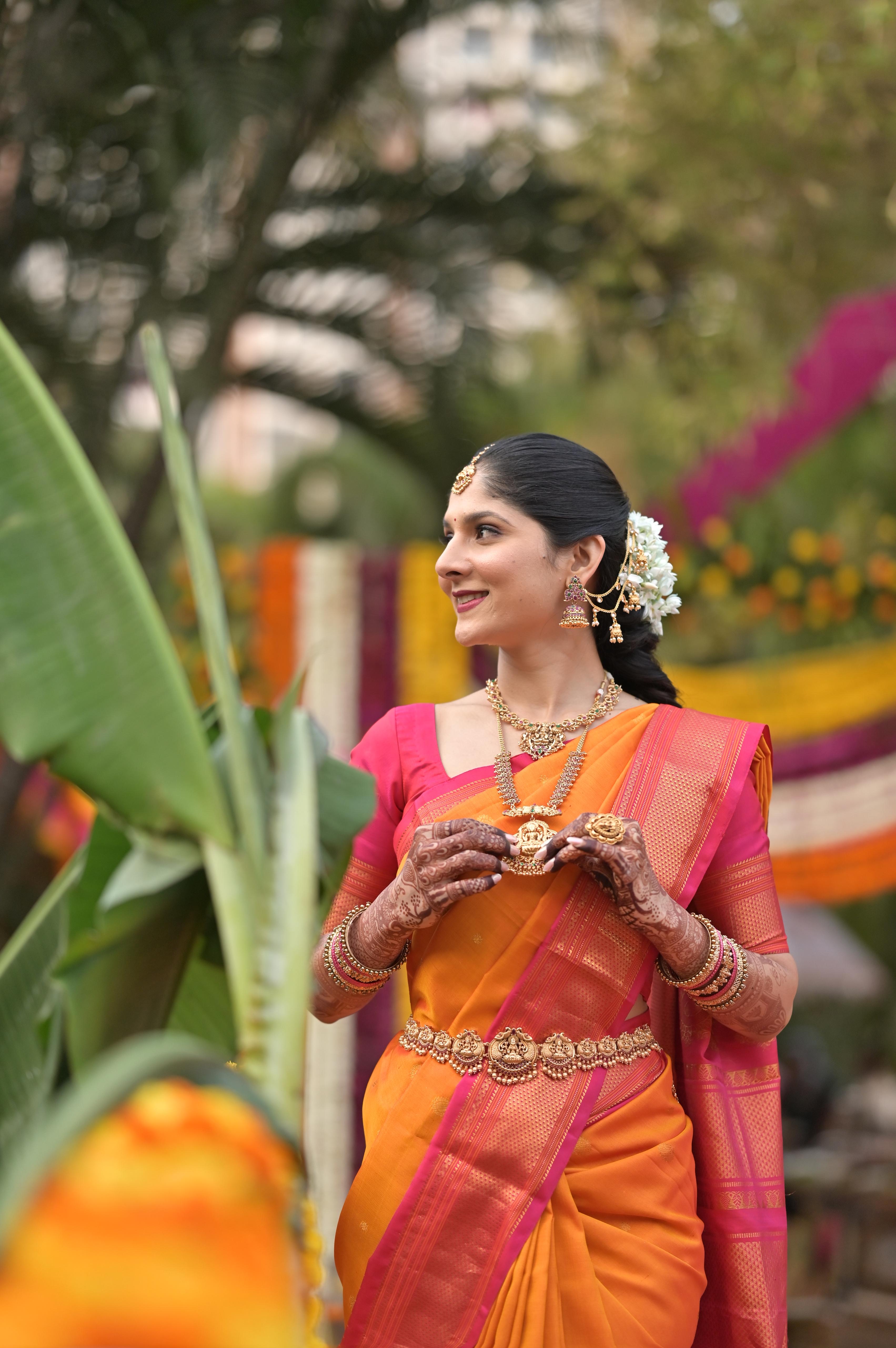 Orange Kanchipuram silk saree with temple jewellery