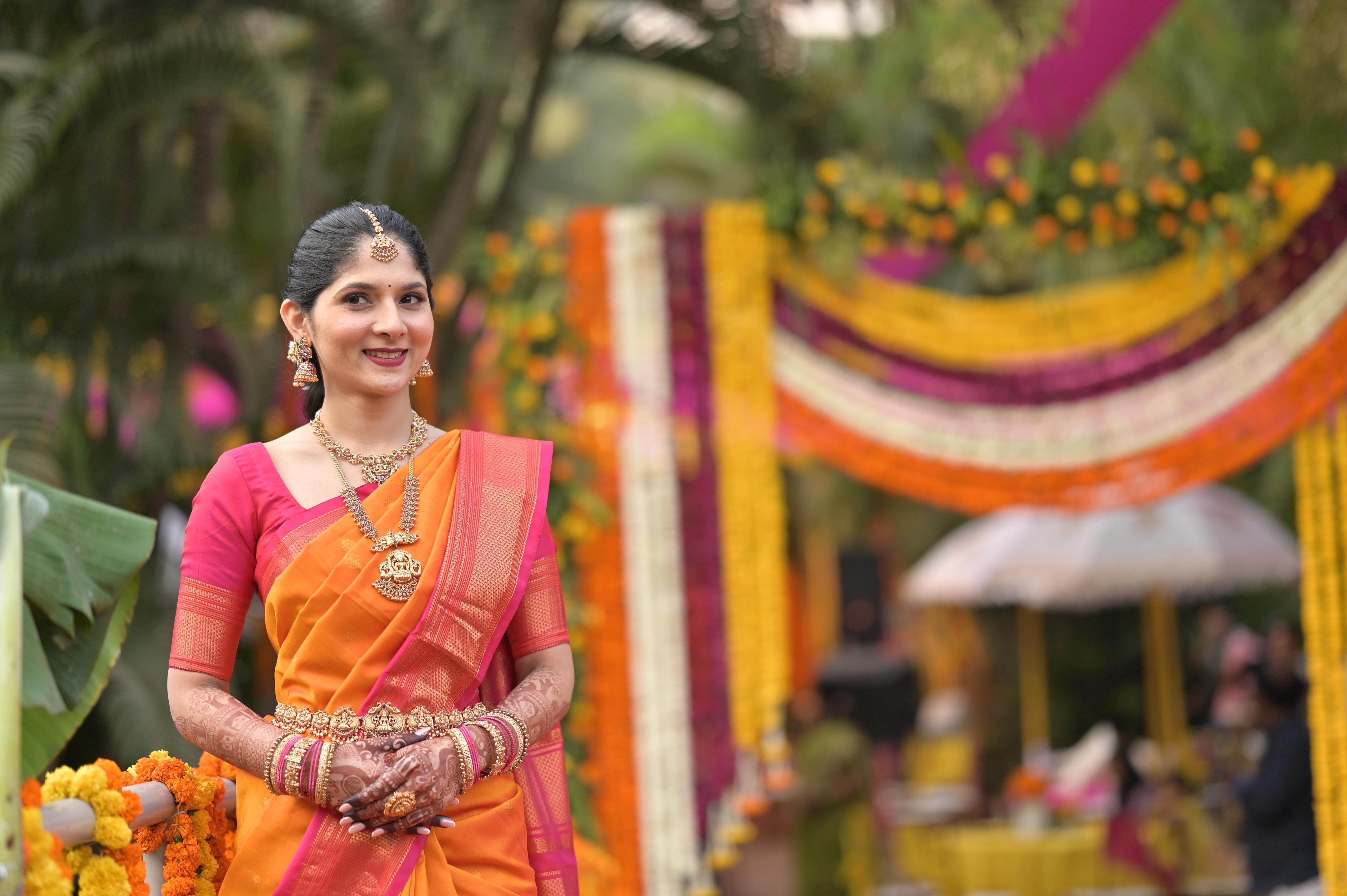 Orange saree at traditional mandap